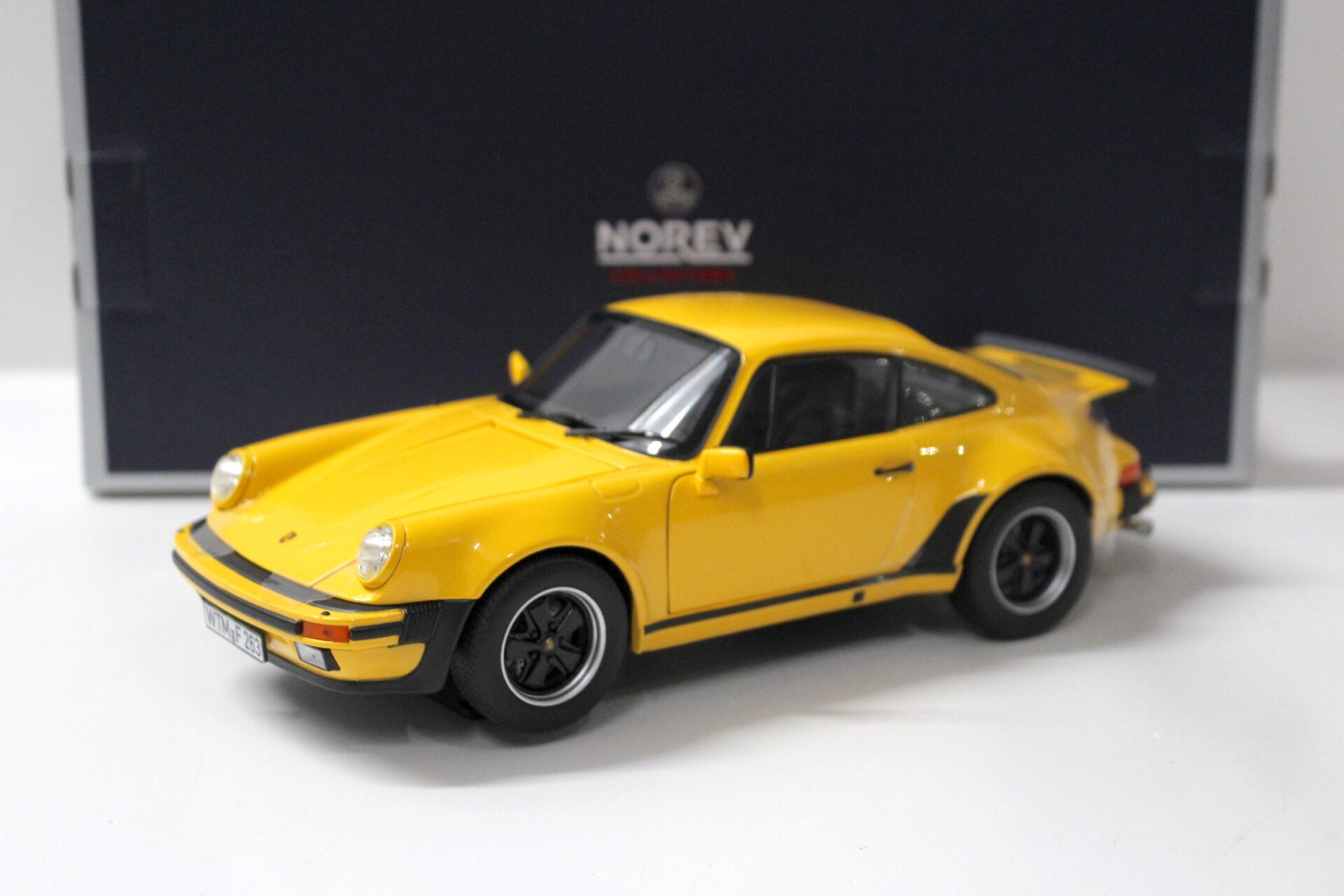 ID 51687 orig 1.jpg 1:18 Norev Porsche 911 Turbo 3.0 Coupe 1976 yellow