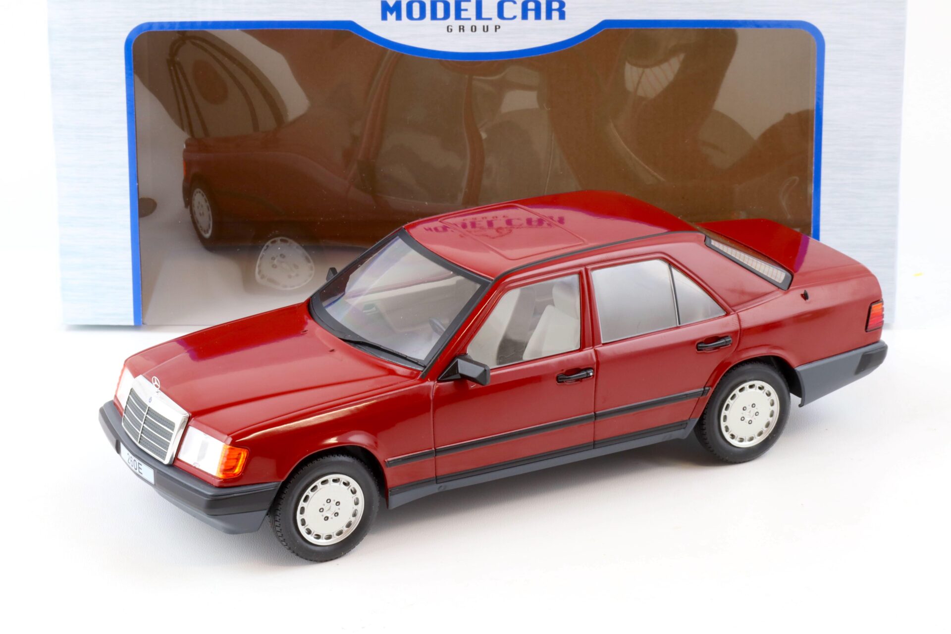 ID 78681 orig.jpg 1:18 MCG Mercedes 260E (W124) Limousine Barolo red 1984