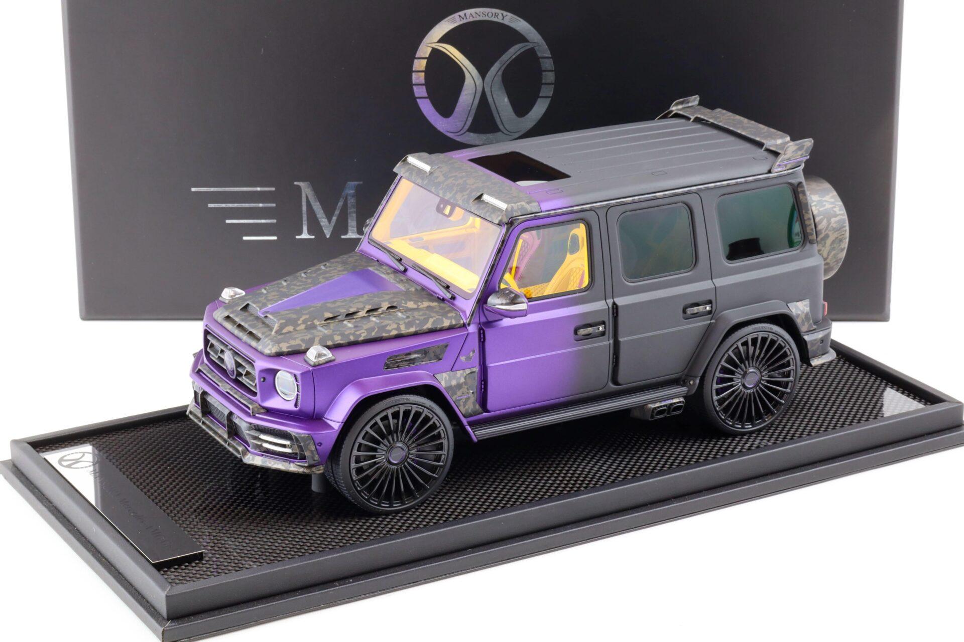 ID 81735 orig 1.jpg 1:18 Motorhelix Mercedes G-Class G63 AMG Mansory UAE matt black/ purple - Limited 99 pcs.