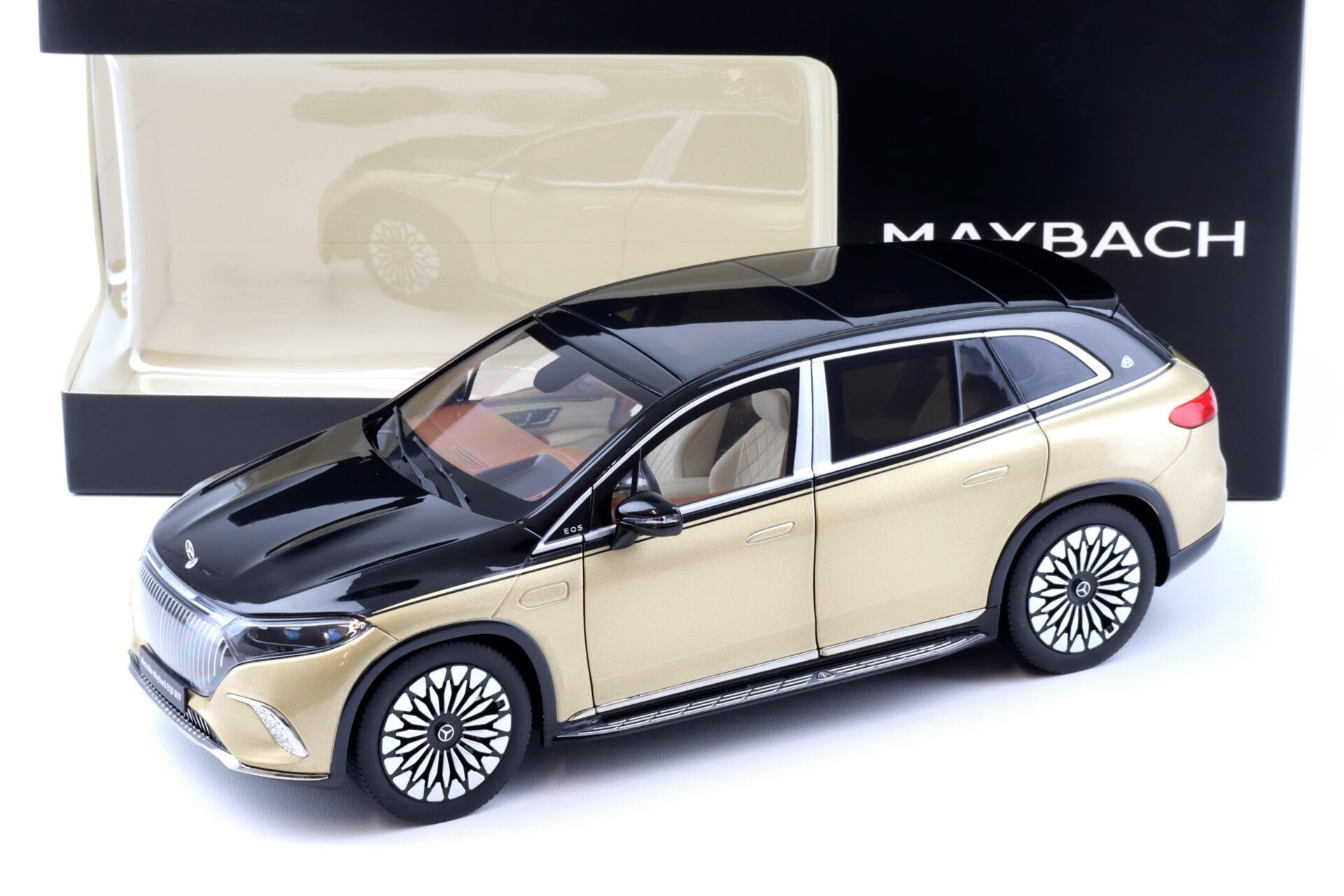 ID 91594 orig.jpg 1:18 NZG Mercedes Maybach EQS 680 SUV black/ Kalahari gold DEALER VERSION