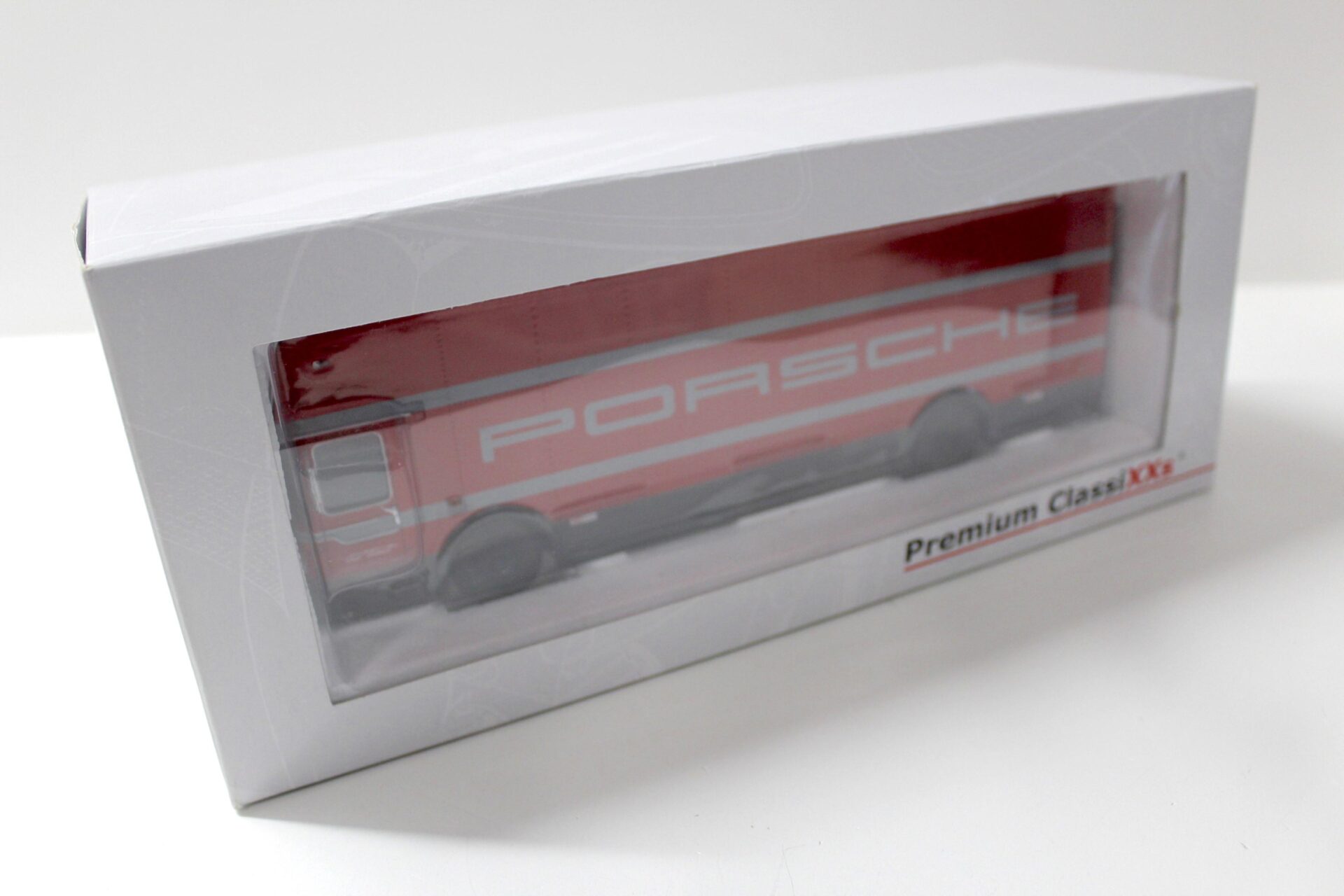 1:43 Premium ClassiXXs Mercedes O317 Renntransporter "PORSCHE" red