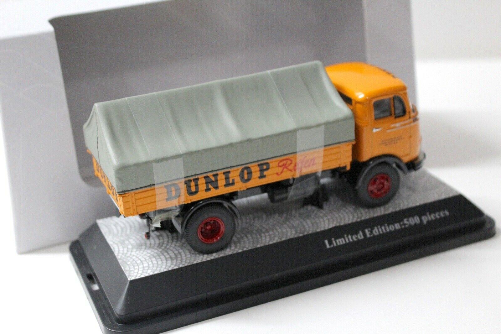 1:43 Premium ClassiXXs Mercedes LP 911 Pritsche/ Plane Dunlop Reifen orange