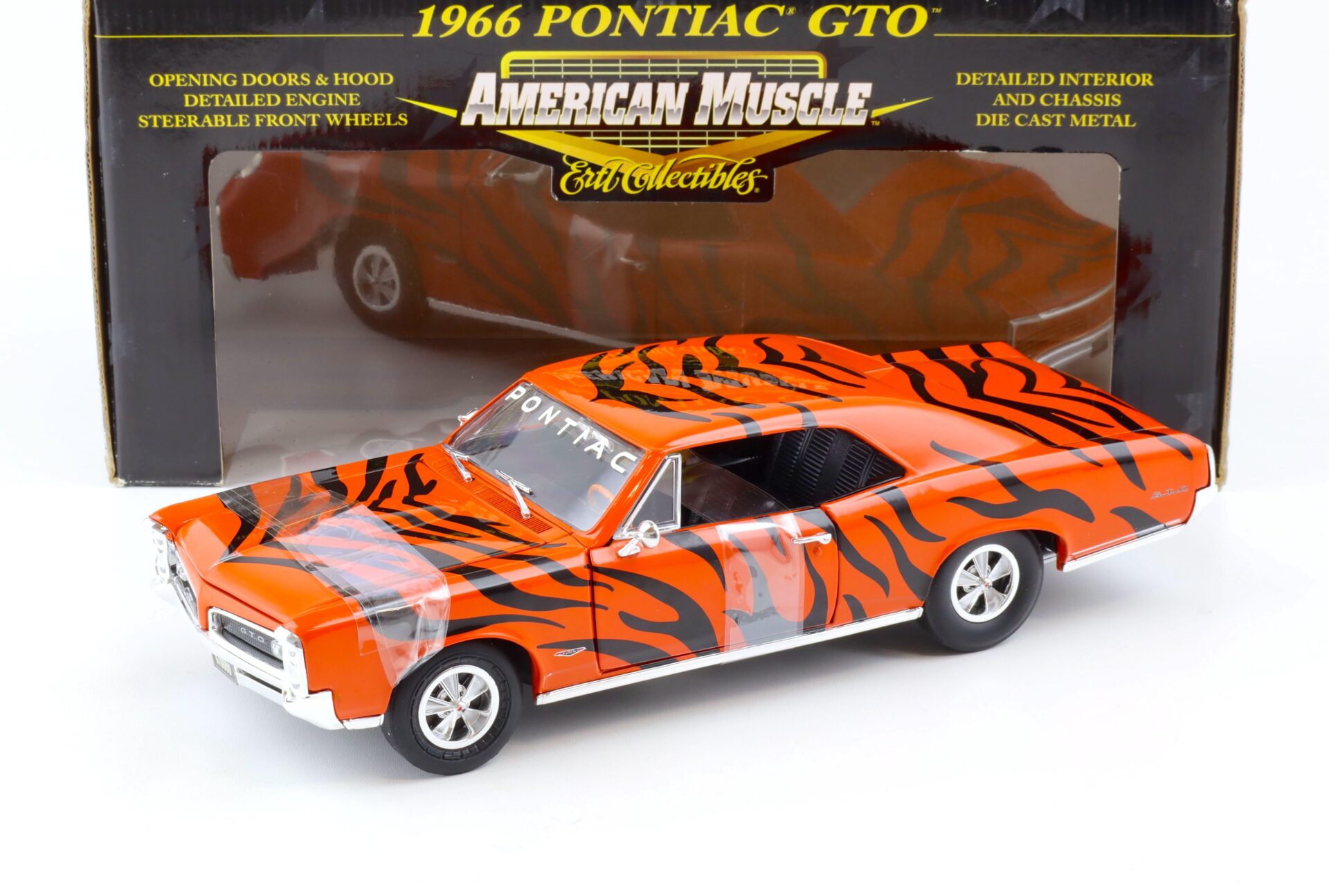 ID 82759 orig.jpg 1:18 ERTL 1966 Pontiac GTO Coupe Arnie Beswick the Farmer Tiger orange/ black