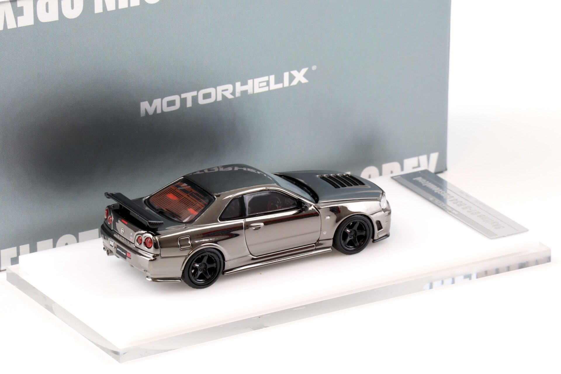 1:64 Motorhelix Nissan Skyline GT-R R34 Nismo Electro. Gun Metal HEC EXPO