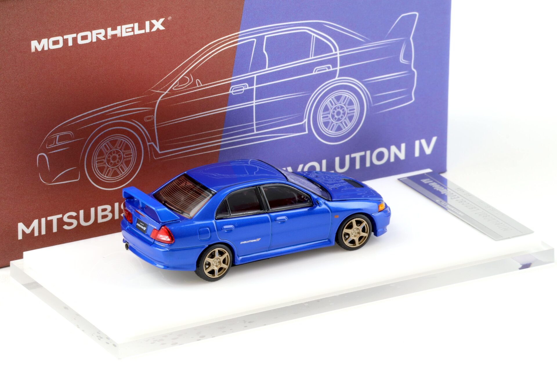 1:64 Motorhelix Mitsubishi Lancer Evolution IV Metal blue + wheels HEC EXPO