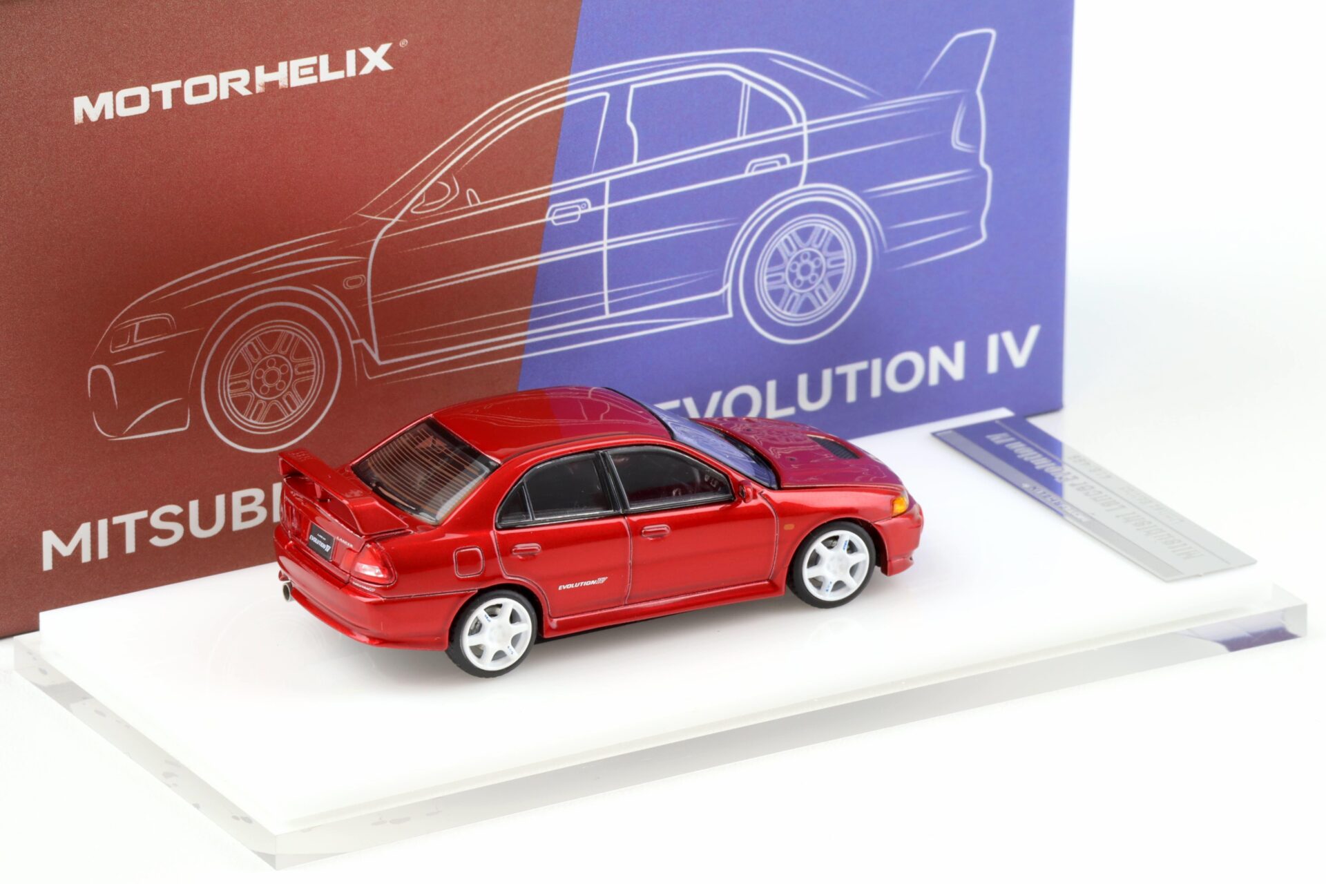 1:64 Motorhelix Mitsubishi Lancer Evolution IV Metal red + wheels HEC EXPO