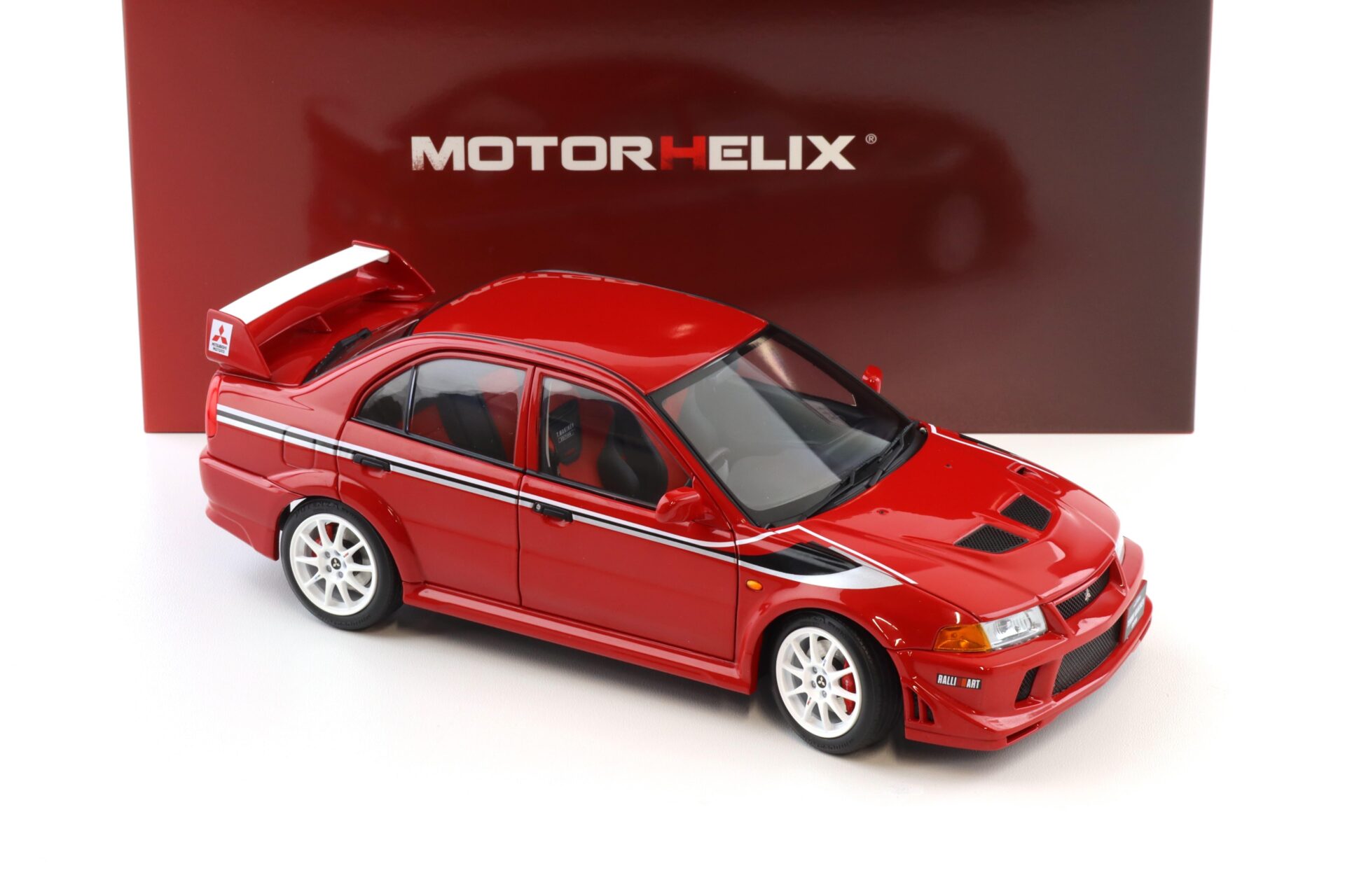 1:18 Motorhelix Mitsubishi Lancer Evolution VI (6.5) GSR T.M.E Passion red M84302