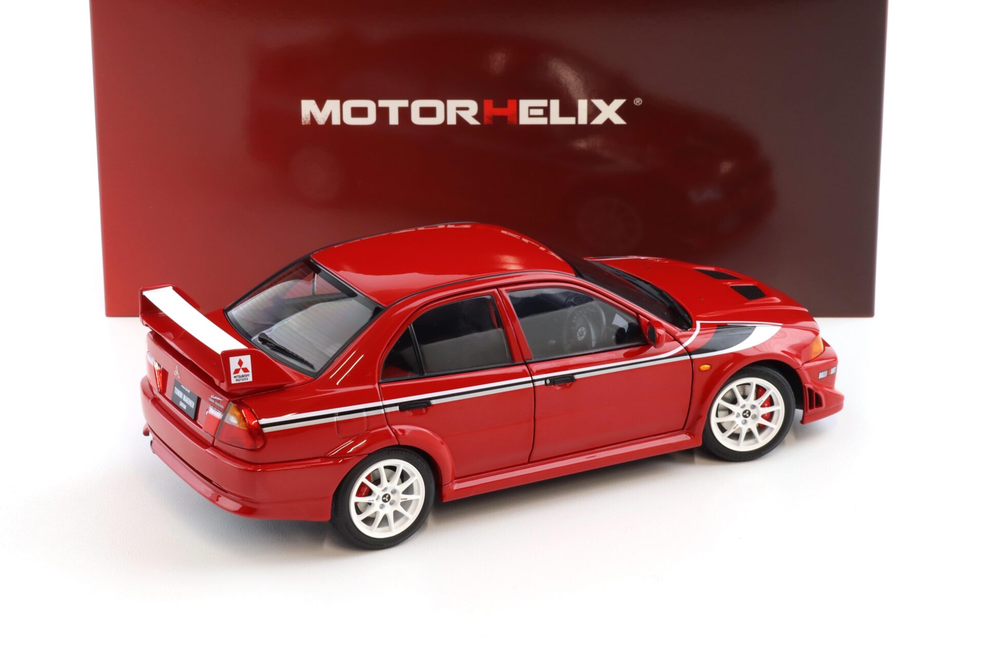 1:18 Motorhelix Mitsubishi Lancer Evolution VI (6.5) GSR T.M.E Passion red M84302