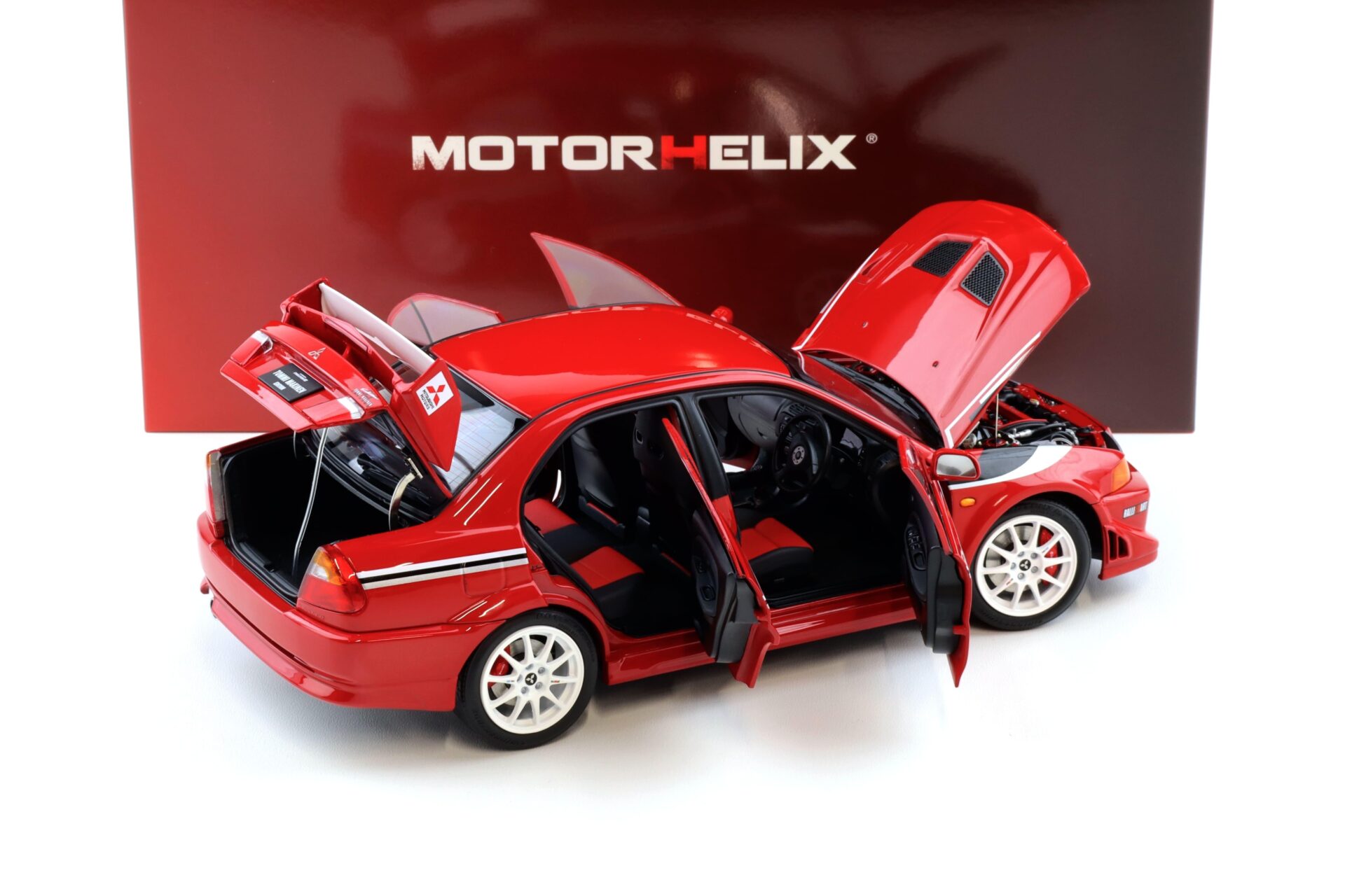 1:18 Motorhelix Mitsubishi Lancer Evolution VI (6.5) GSR T.M.E Passion red M84302