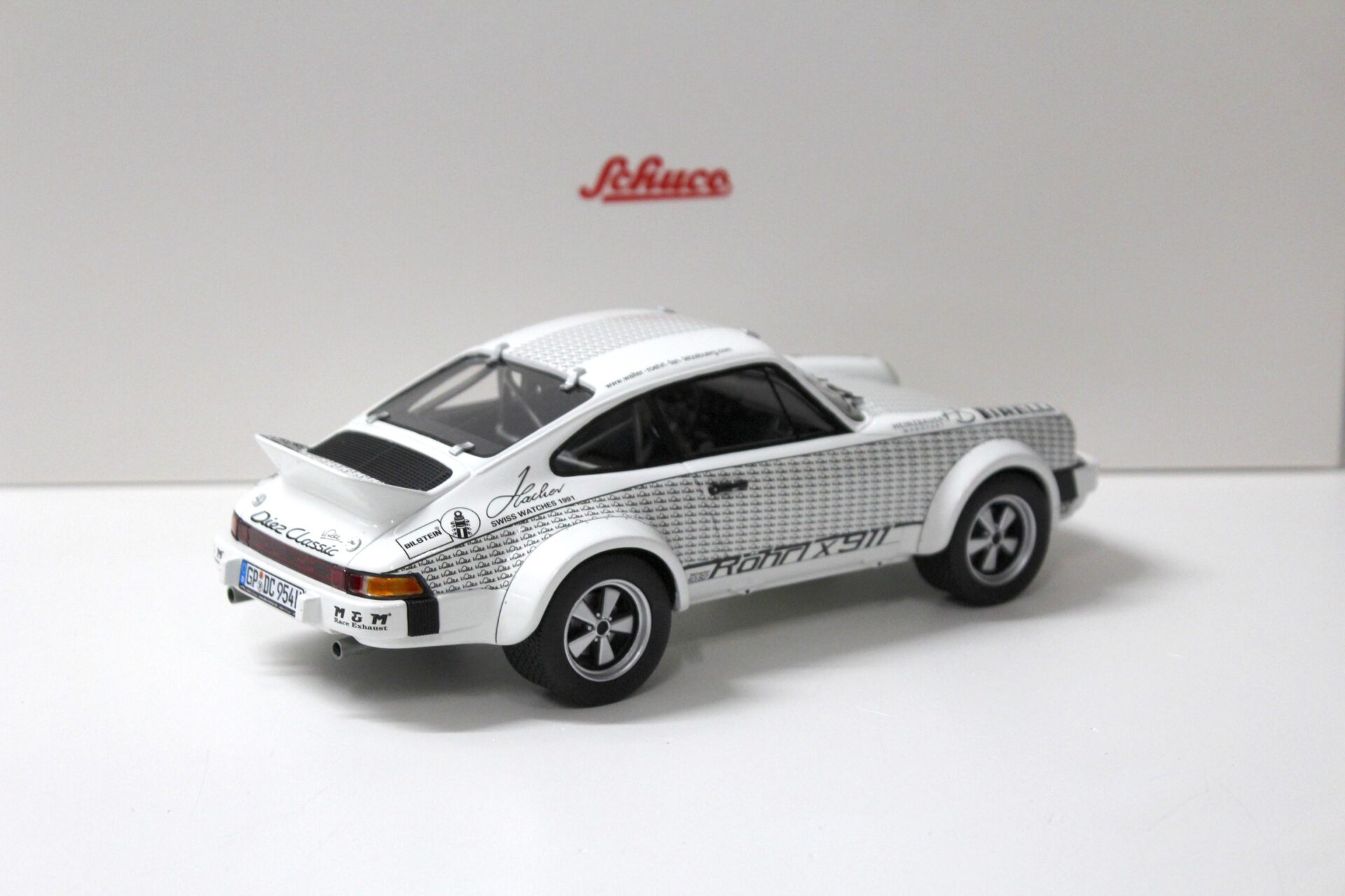 1:18 Schuco Porsche 911 Rallye x911 + Figur Walter Röhrl white/ black