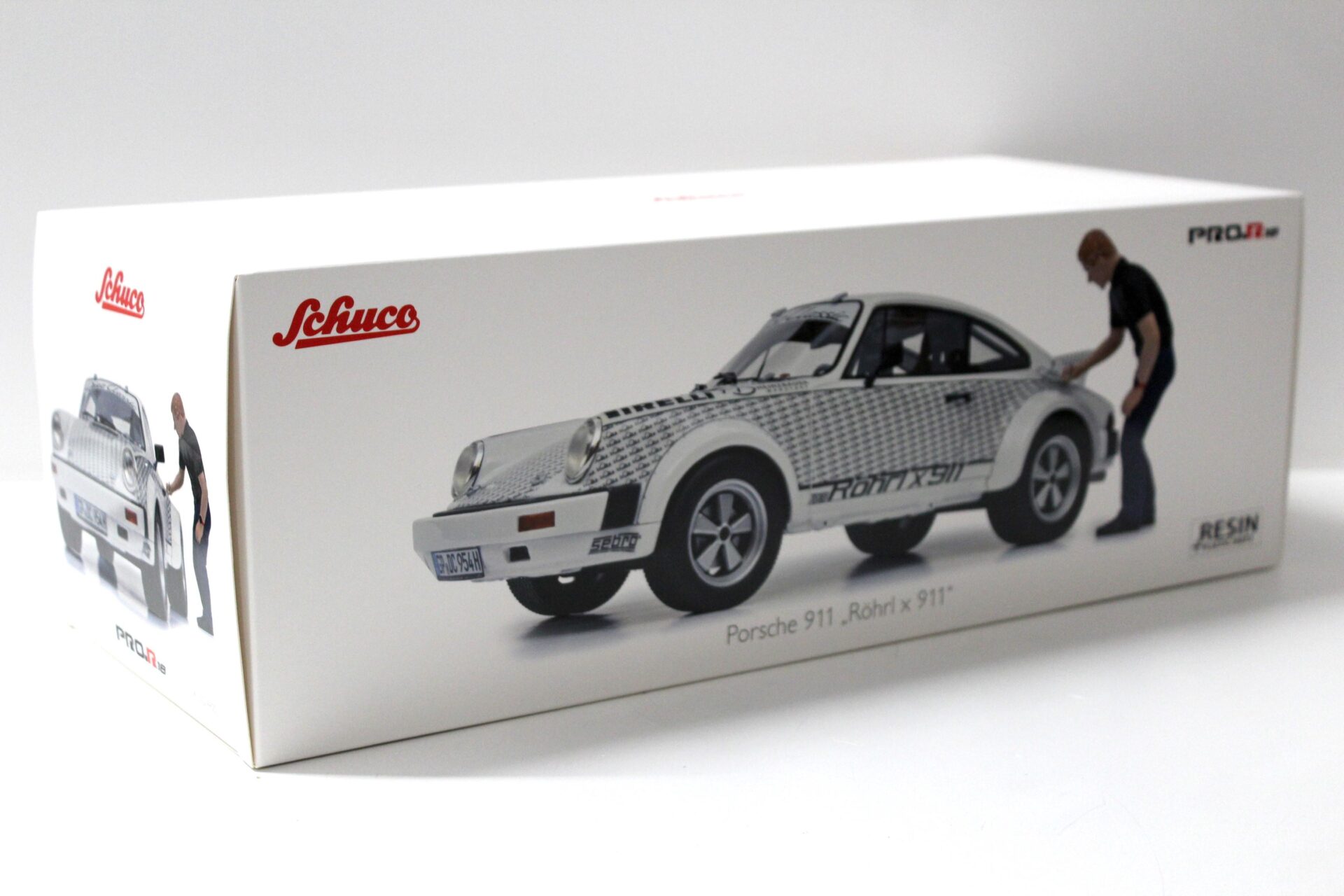 1:18 Schuco Porsche 911 Rallye x911 + Figur Walter Röhrl white/ black