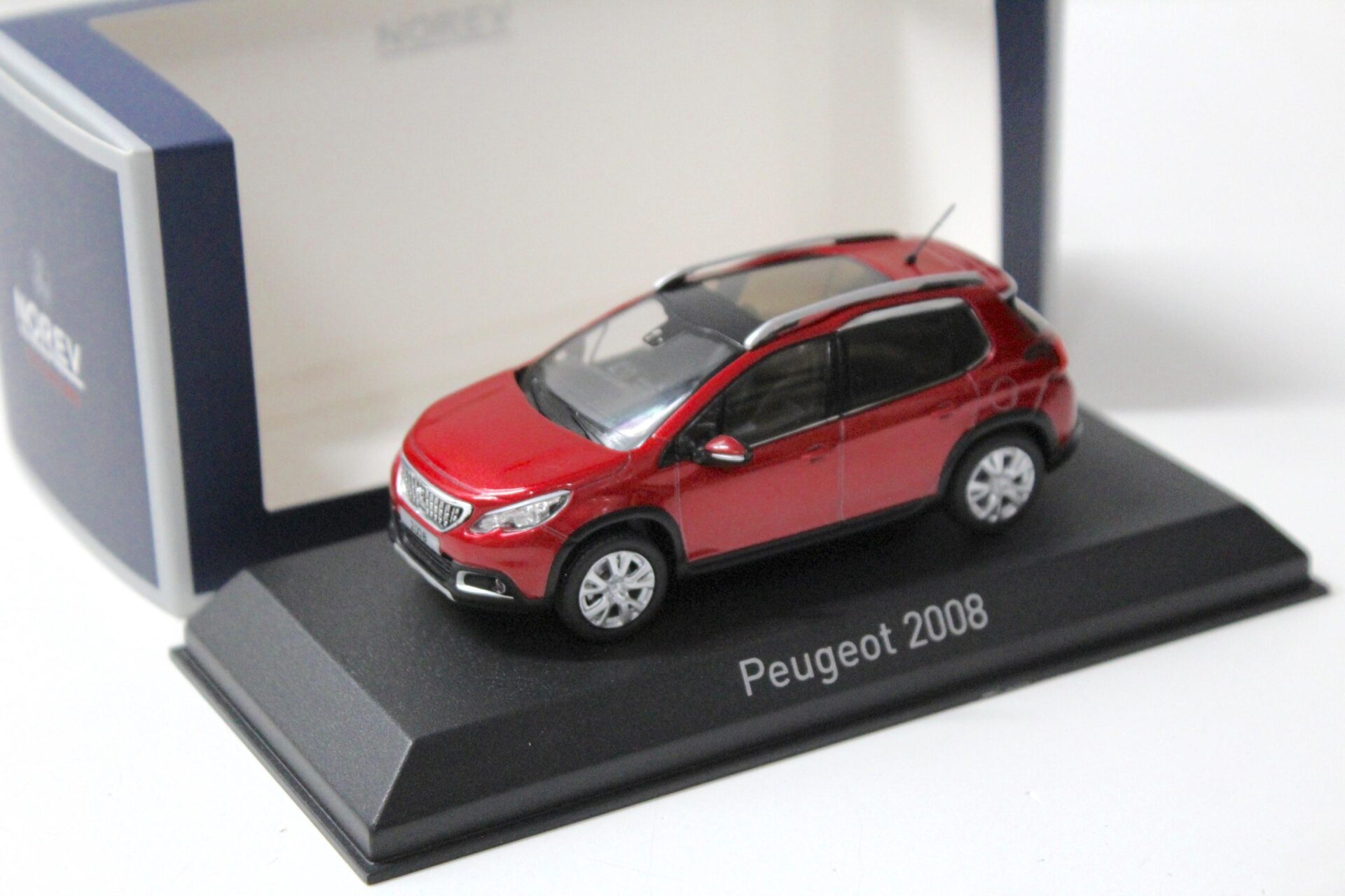 ID 56726 orig.jpg 1:43 Norev Peugeot 2008 Ultimate red 2016