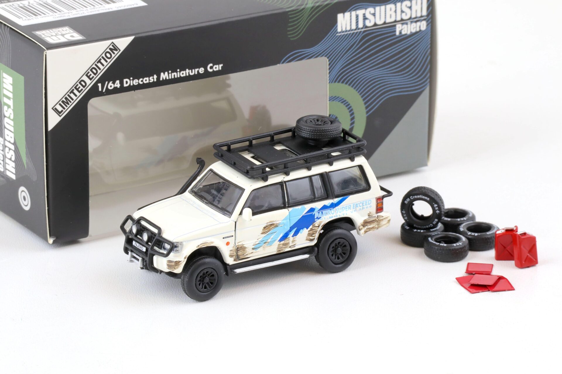 ID 75767 orig.jpg 1:64 BMC BM Creations 1996 Mitsubishi Pajero 2nd. Gen. RHD Jungle Pack white