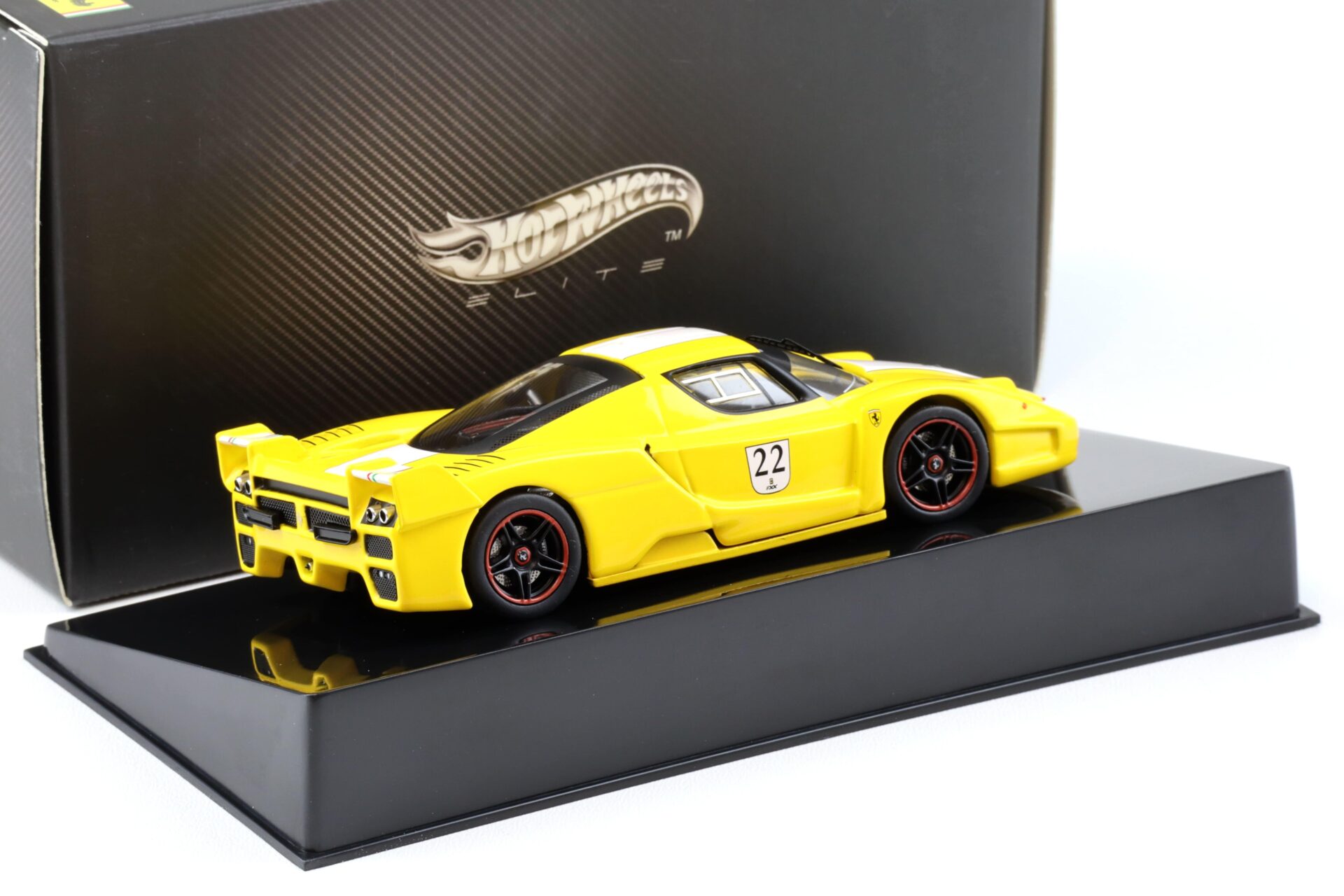 1:43 Hot Wheels Elite Ferrari FXX #22 yellow/ white stripe N5612