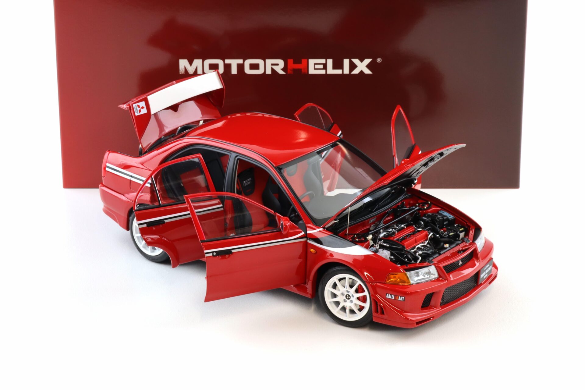 1:18 Motorhelix Mitsubishi Lancer Evolution VI (6.5) GSR T.M.E Passion red M84302