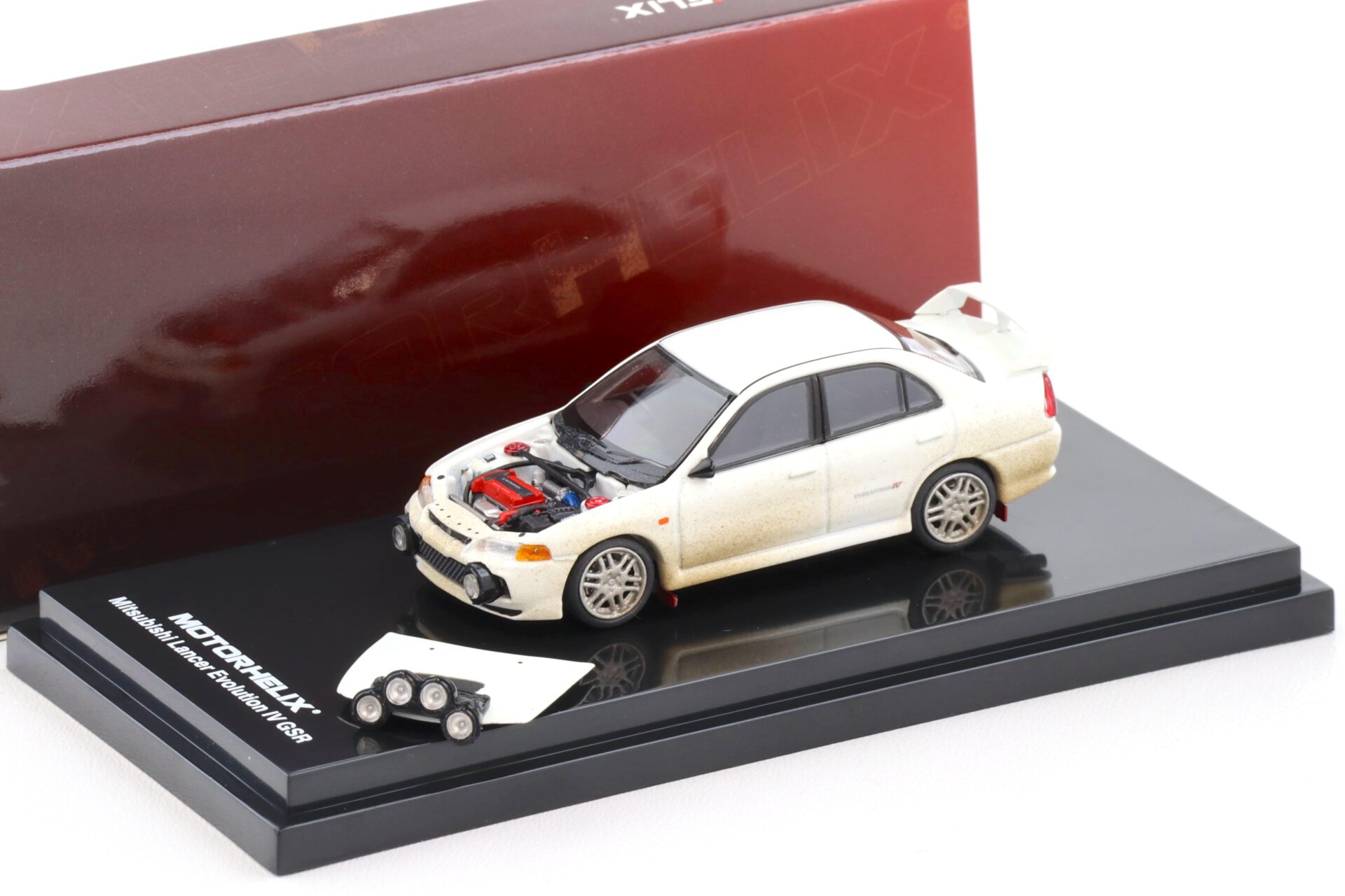 1:64 Motorhelix Mitsubishi Lancer Evolution IV GSR Muddy Version with Rally light