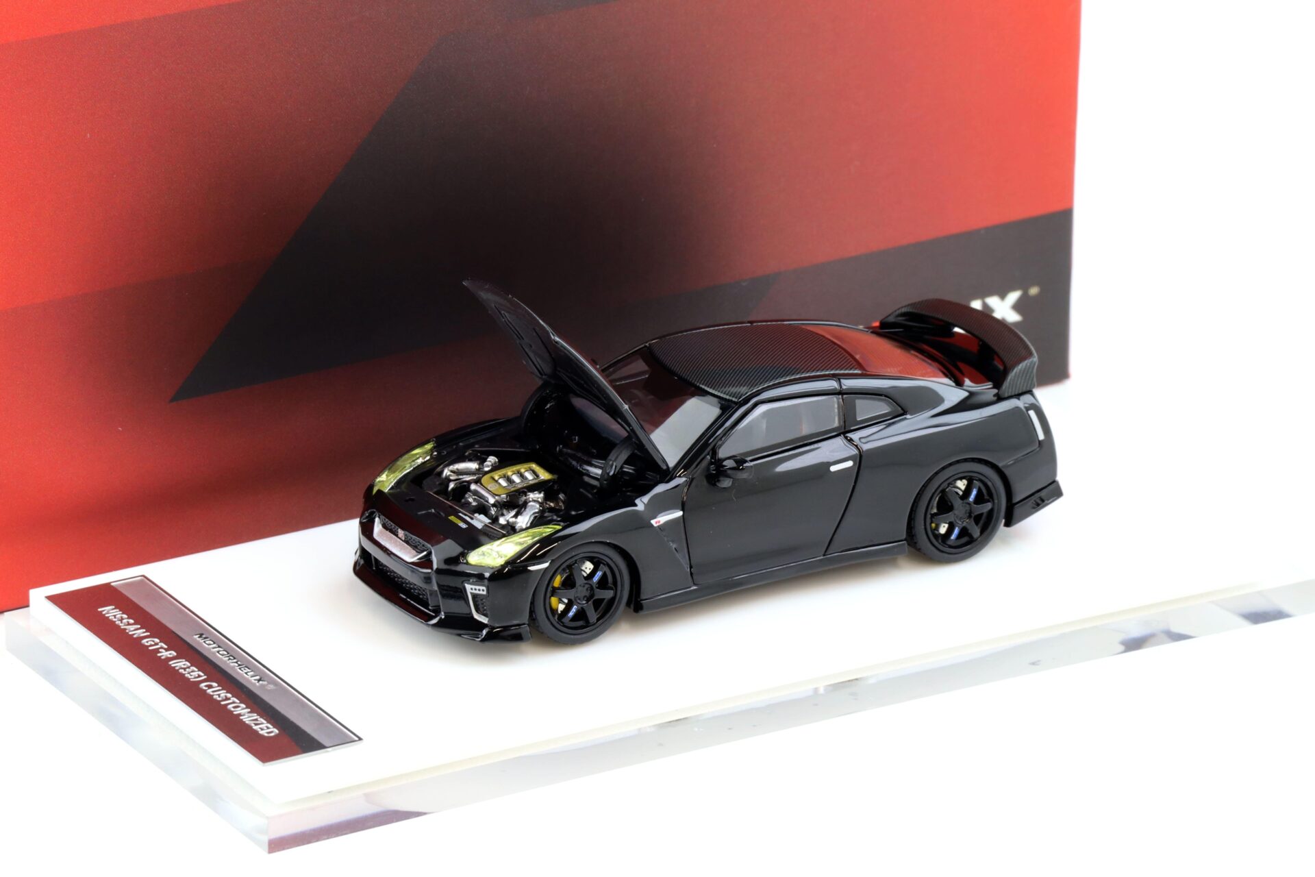 1:64 Motorhelix Nissan GT-R R35 with Customized Headlights black/ Carbon
