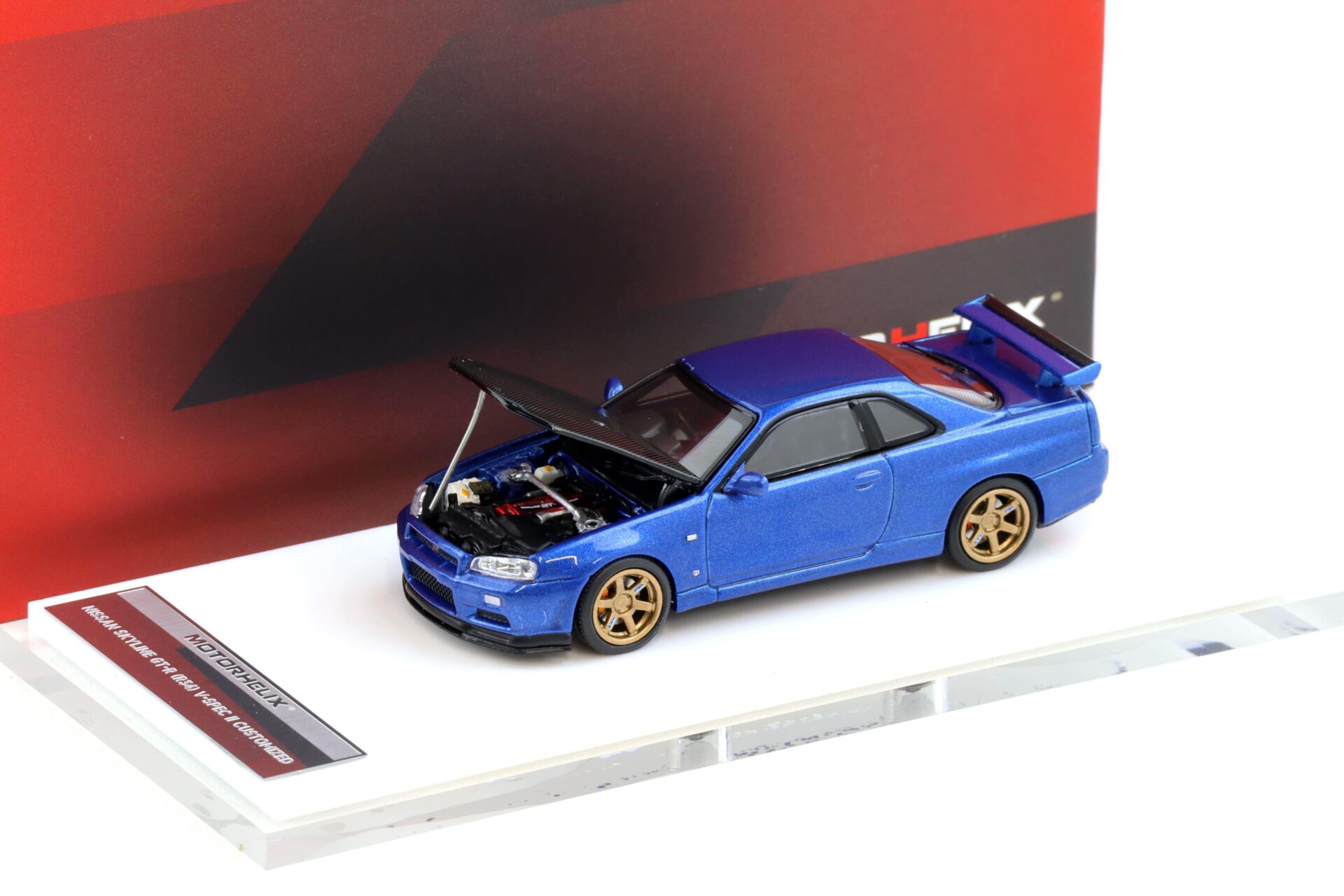 1:64 Motorhelix Nissan Skyline GT-R R34 V-Spec II Bayside blue/ Carbon hood