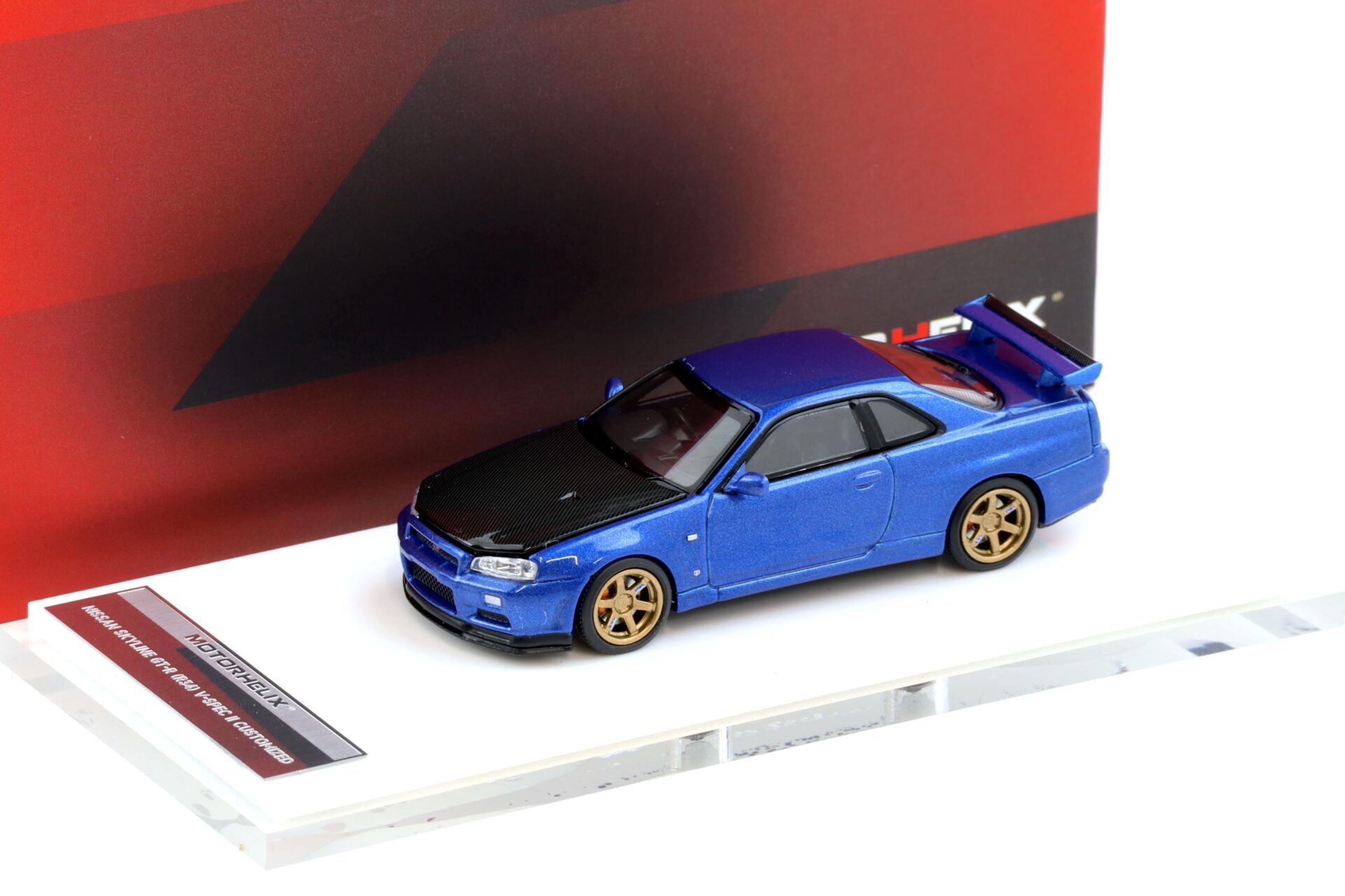 1:64 Motorhelix Nissan Skyline GT-R R34 V-Spec II Bayside blue/ Carbon hood