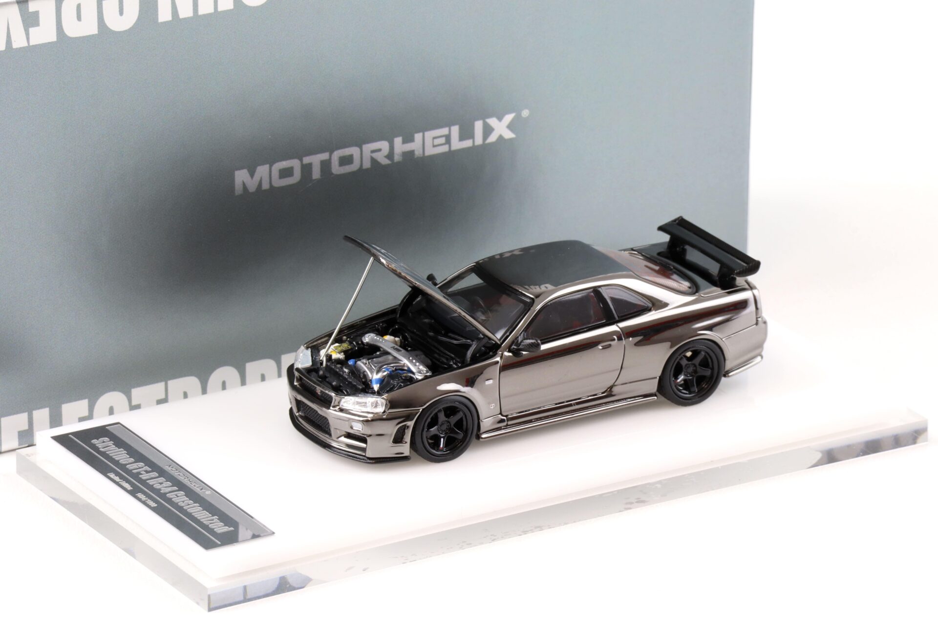 1:64 Motorhelix Nissan Skyline GT-R R34 Nismo Electro. Gun Metal HEC EXPO