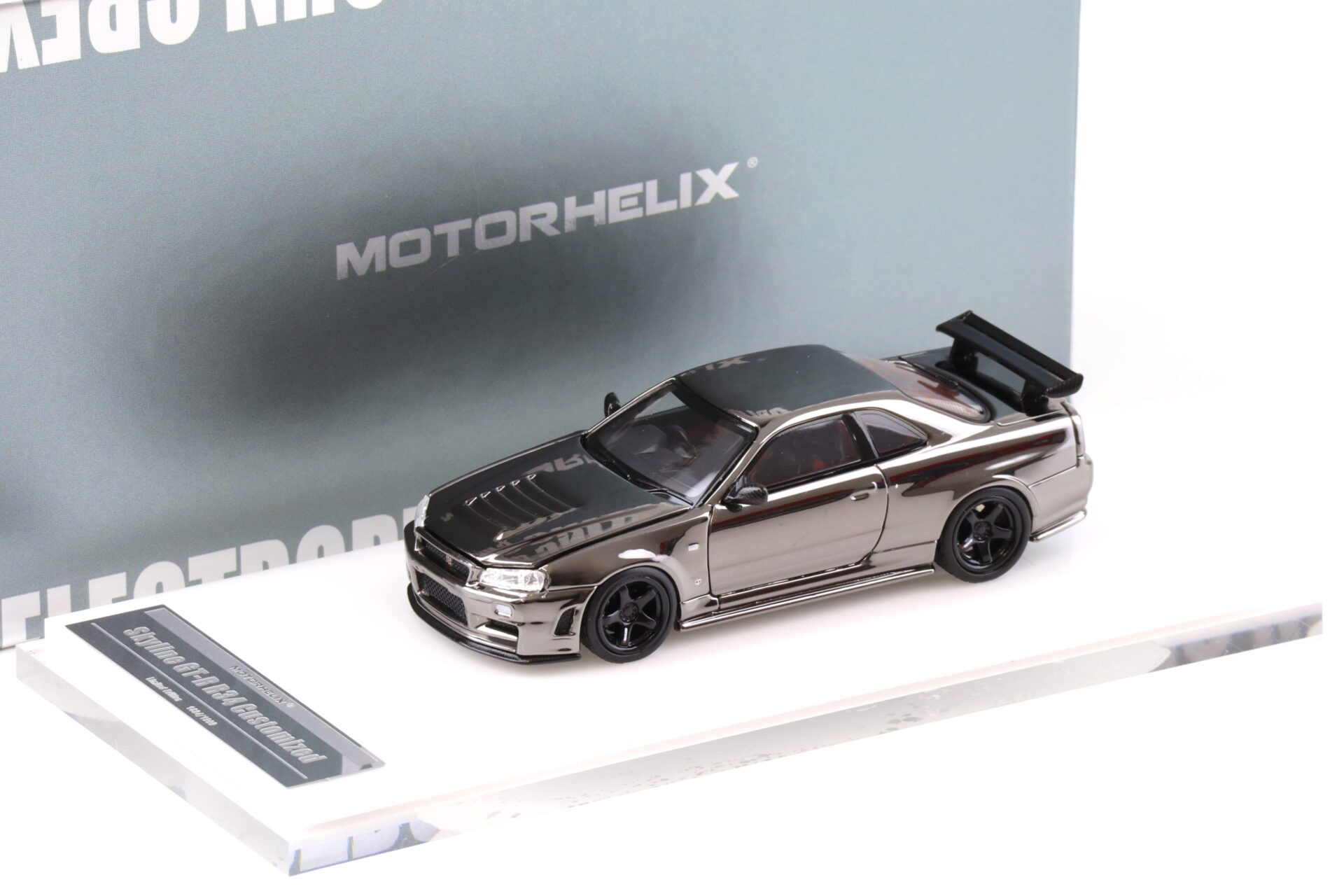 1:64 Motorhelix Nissan Skyline GT-R R34 Nismo Electro. Gun Metal HEC EXPO