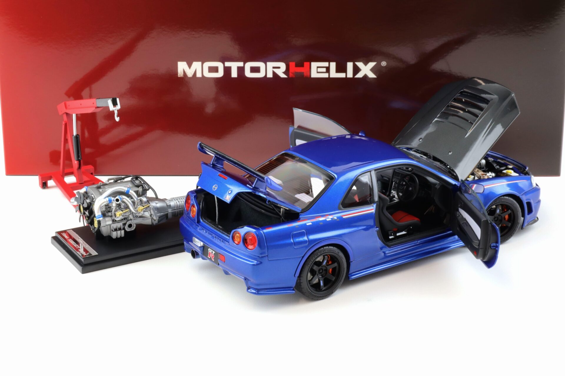1:18 Motorhelix Nissan Skyline GT-R R34 Nismo CRS Bayside blue/ Carbon hood M83430
