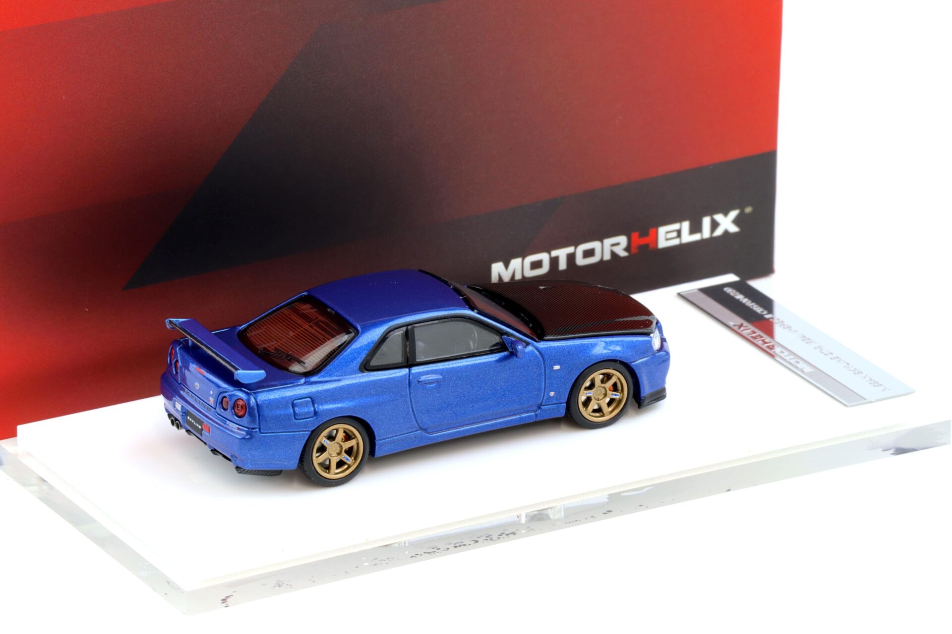 1:64 Motorhelix Nissan Skyline GT-R R34 V-Spec II Bayside blue/ Carbon hood