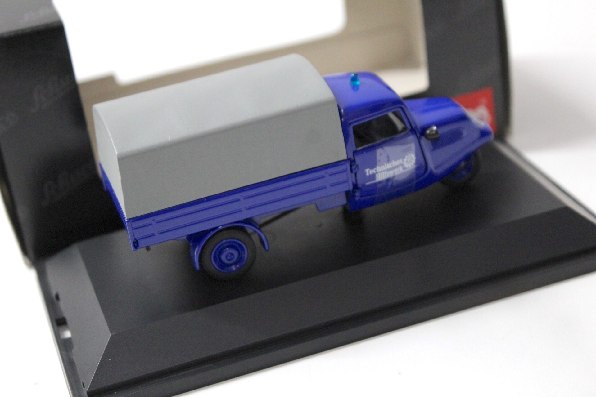 1:43 Schuco Tempo Planenwagen "Technisches Hilfswerk" THW blue
