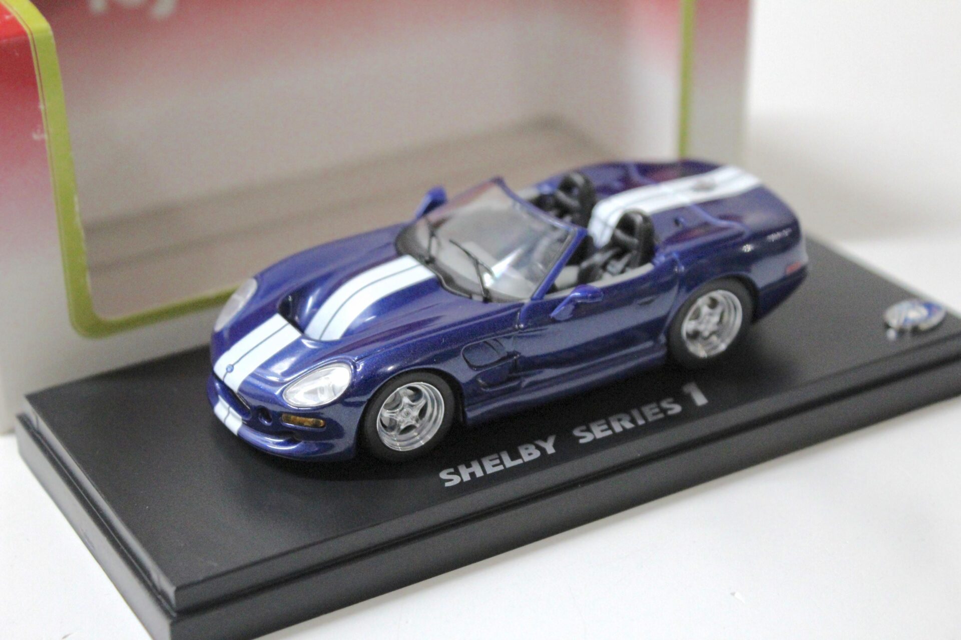 1:43 Kyosho Shelby Series 1 blue metallic/ white stripes