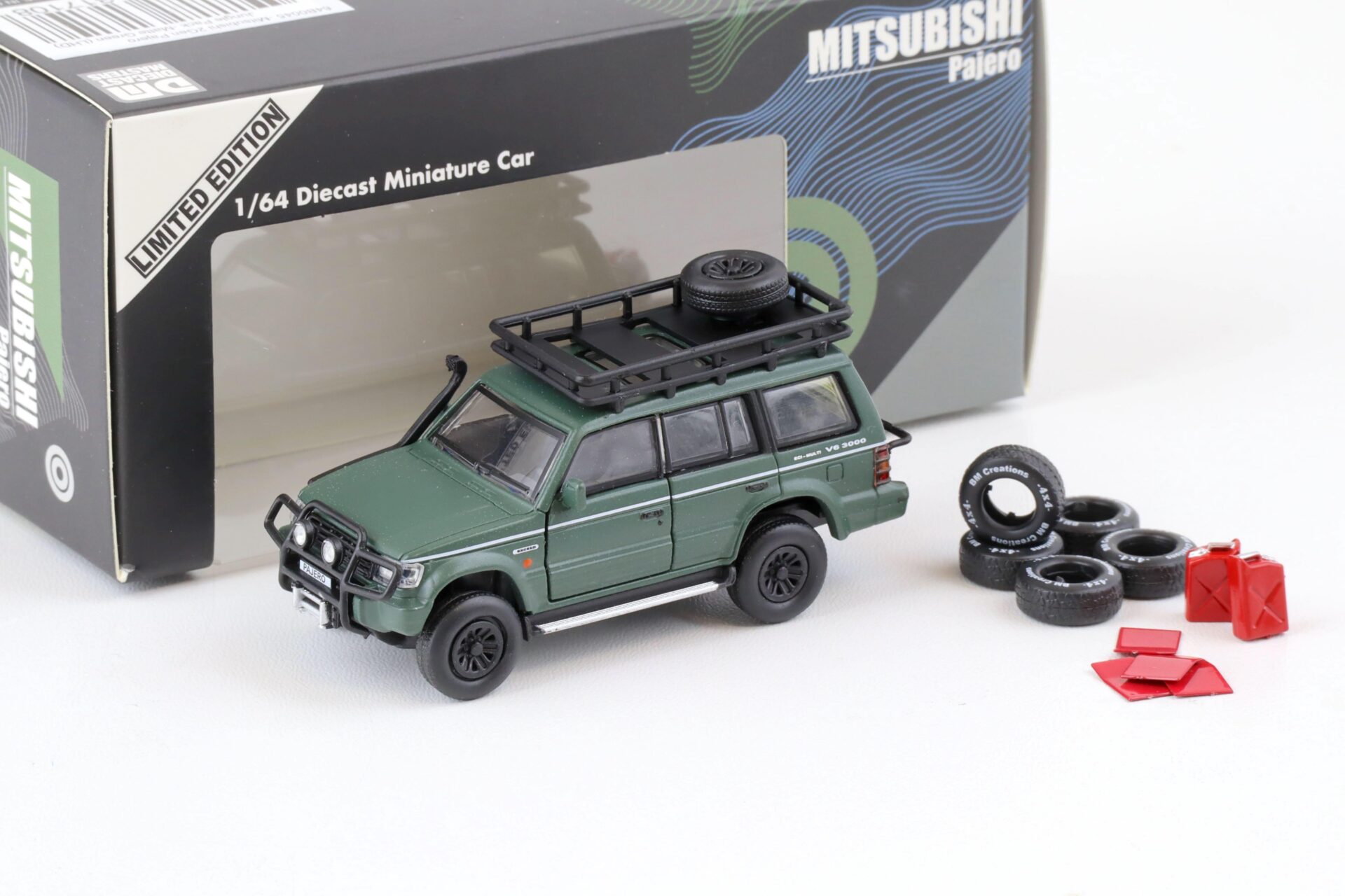 ID 75759 orig.jpg 1:64 BMC BM Creations 1996 Mitsubishi Pajero 2nd. Gen. LHD Jungle Pack matt green