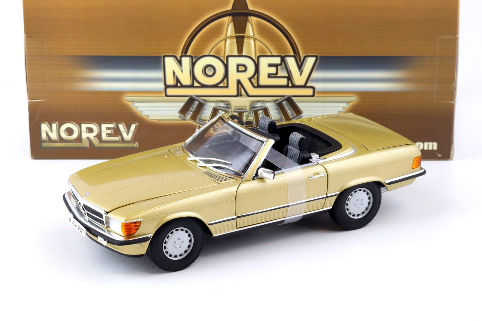 ID 86754 orig.jpg 1:18 Norev Mercedes 300SL Cabriolet W107 gold metallic with Soft Top 183508