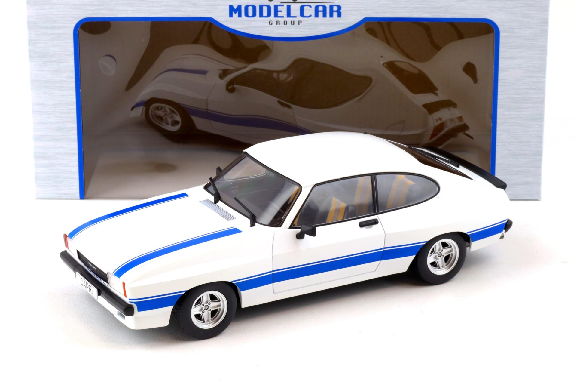 ID 87863 orig.jpg 1:18 MCG Ford Capri MK II X-Pack white/ blue stripes LHD 1975