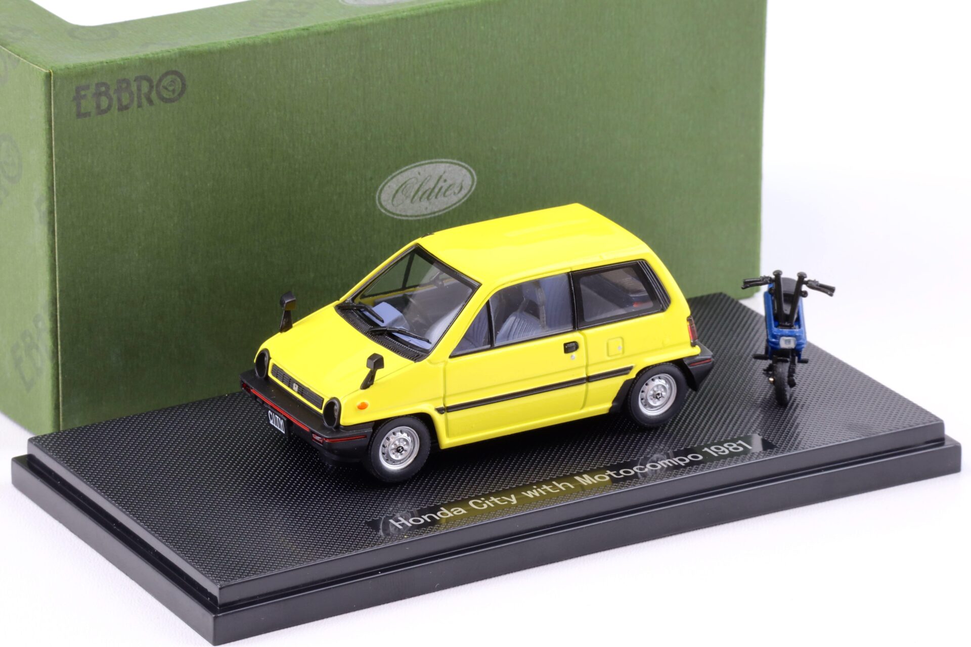 ID 94469 orig.jpg 1:43 Ebbro Honda City 1981 yellow with Motocompo